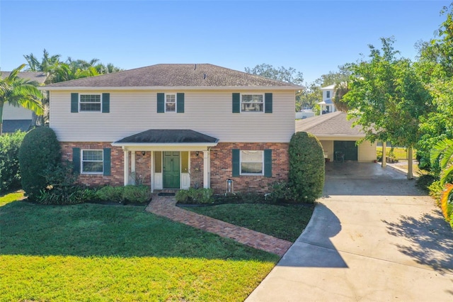 view of front of property with driveway, a front yard, and brick siding