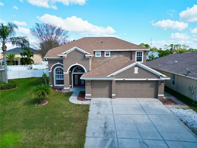 2012 Fern Ridge Ct, Holiday, FL 34691 - view of front facade featuring stucco siding, a garage, and driveway