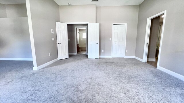 2012 Fern Ridge Ct, Holiday, FL 34691 - unfurnished bedroom with carpet floors, baseboards, and a closet
