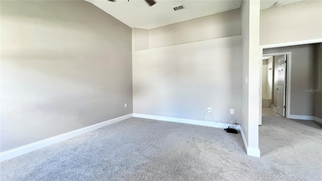 2012 Fern Ridge Ct, Holiday, FL 34691 - unfurnished room featuring carpet, a ceiling fan, baseboards, and lofted ceiling