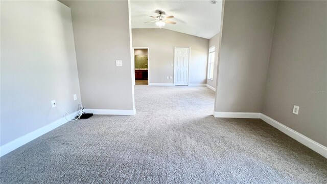 2012 Fern Ridge Ct, Holiday, FL 34691 - empty room with a ceiling fan, carpet flooring, baseboards, and vaulted ceiling