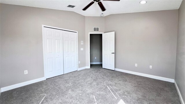 2012 Fern Ridge Ct, Holiday, FL 34691 - unfurnished bedroom featuring carpet, vaulted ceiling, a closet, baseboards, and ceiling fan