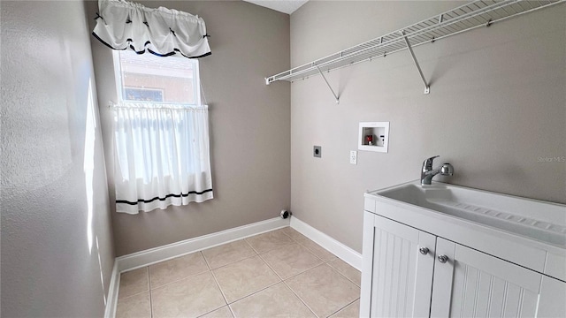 2012 Fern Ridge Ct, Holiday, FL 34691 - washroom with hookup for a washing machine, light tile patterned floors, baseboards, cabinet space, and electric dryer hookup