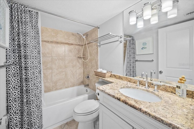 full bathroom featuring shower / bath combo, tile patterned floors, a textured ceiling, toilet, and vanity