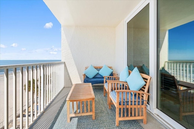 balcony with a view of the beach and a water view