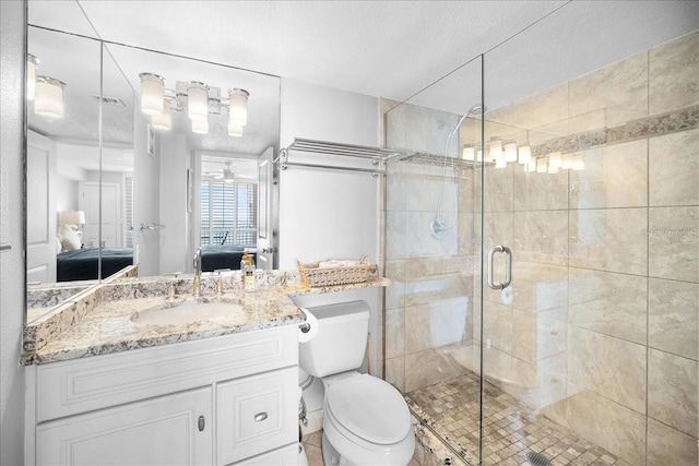 bathroom featuring toilet, an enclosed shower, a textured ceiling, and vanity