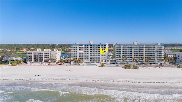 aerial view featuring a view of the beach and a water view