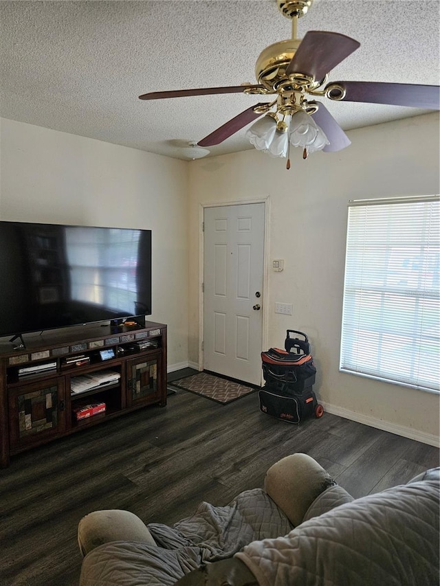 1252 Costa Mesa Dr, Wesley Chapel, FL 33543 - living room featuring wood finished floors, ceiling fan, baseboards, and a textured ceiling