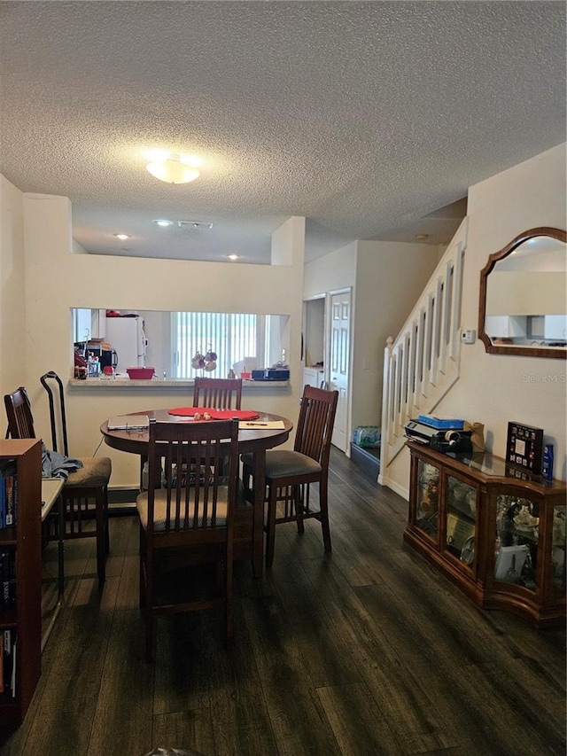 1252 Costa Mesa Dr, Wesley Chapel, FL 33543 - dining space with a textured ceiling, wood finished floors, and stairs
