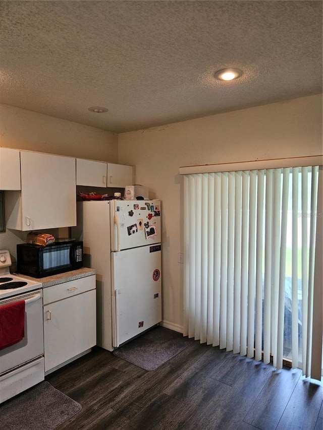1252 Costa Mesa Dr, Wesley Chapel, FL 33543 - kitchen featuring white appliances, dark wood-type flooring, white cabinetry, a textured ceiling, and light countertops