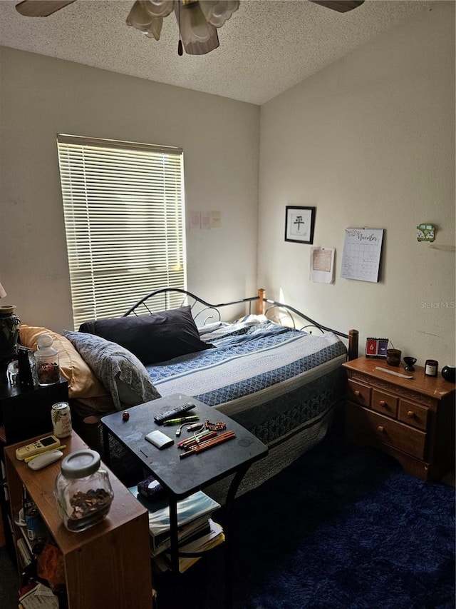 1252 Costa Mesa Dr, Wesley Chapel, FL 33543 - bedroom featuring a textured ceiling and a ceiling fan