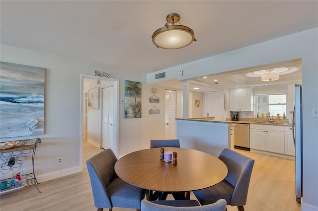 dining area featuring light hardwood / wood-style flooring