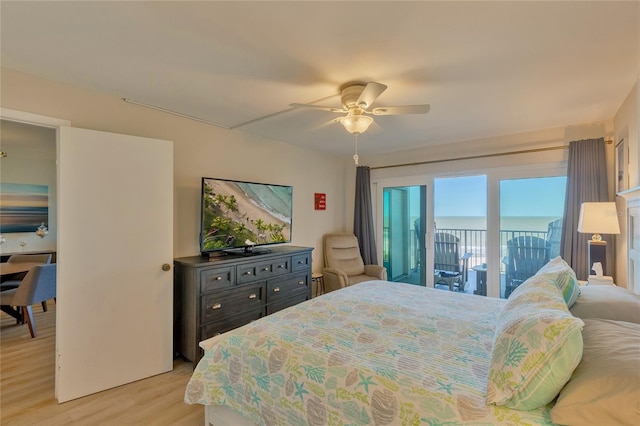 bedroom featuring ceiling fan, light wood-type flooring, and access to outside