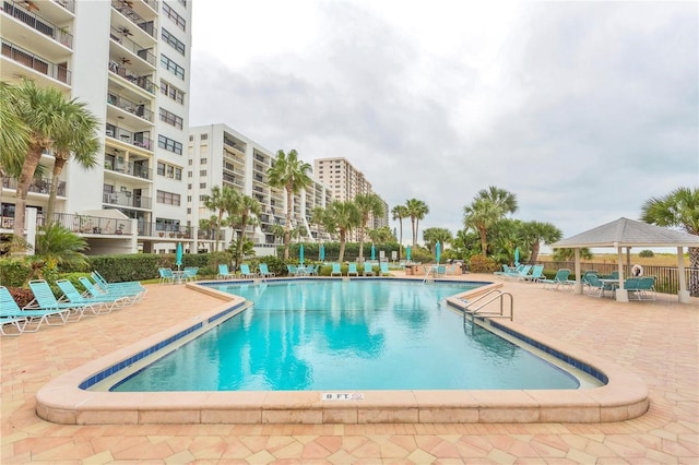 view of swimming pool featuring a gazebo and a patio area