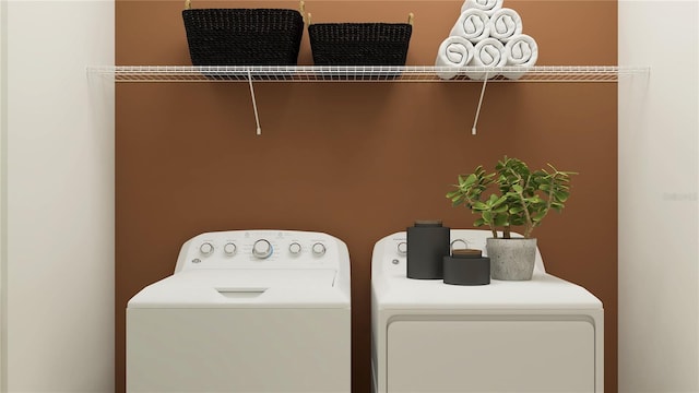 washroom featuring washer and clothes dryer