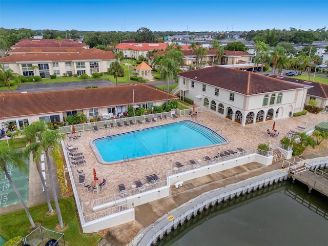 view of pool featuring a water view