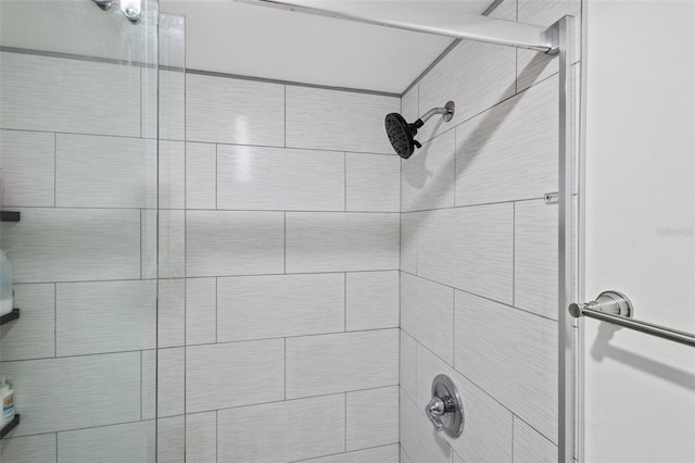 bathroom with a tile shower