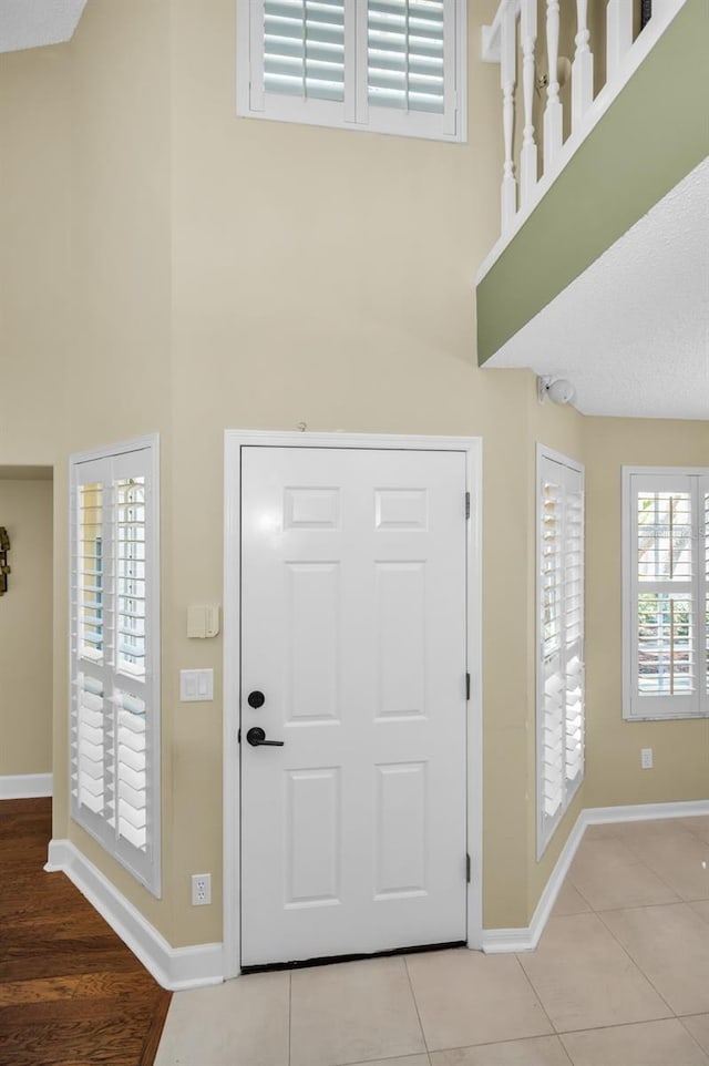 foyer featuring light tile patterned flooring