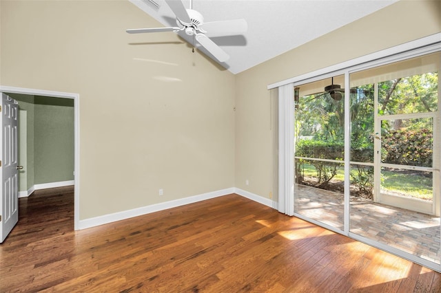 empty room featuring dark hardwood / wood-style flooring and lofted ceiling