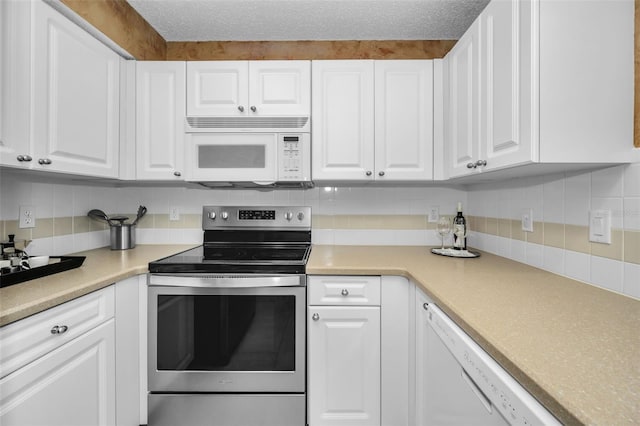 kitchen featuring decorative backsplash, a textured ceiling, white appliances, and white cabinetry