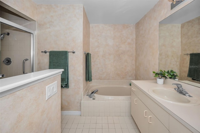 bathroom featuring tile patterned flooring, vanity, and shower with separate bathtub