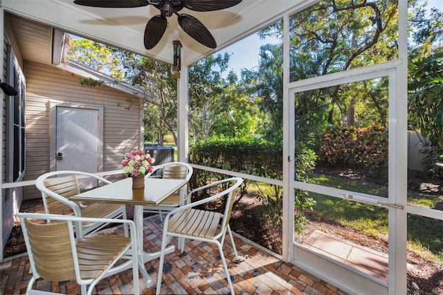 sunroom with ceiling fan and a healthy amount of sunlight