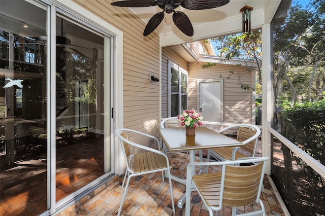 sunroom with ceiling fan and a skylight