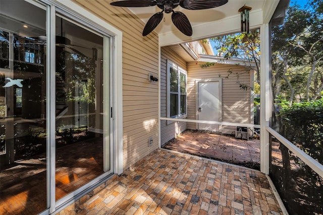 sunroom featuring a skylight and ceiling fan