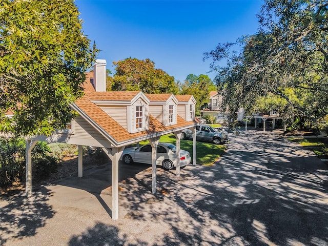 view of front facade with a carport