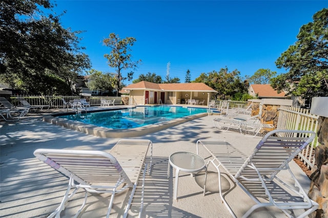 view of swimming pool with a patio