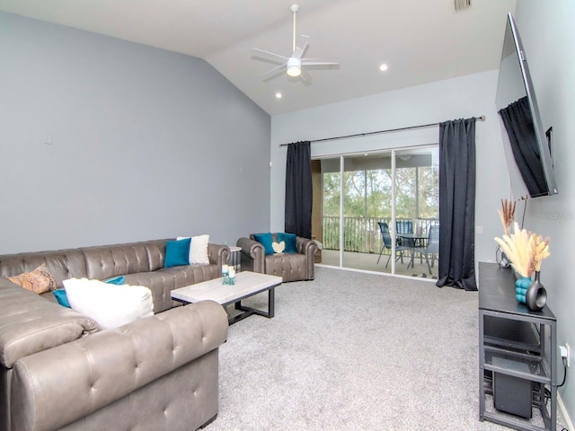 living room featuring ceiling fan, carpet, and vaulted ceiling