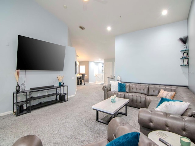 living room featuring light carpet and ceiling fan