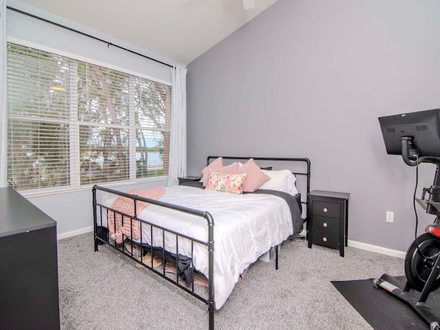 carpeted bedroom featuring vaulted ceiling