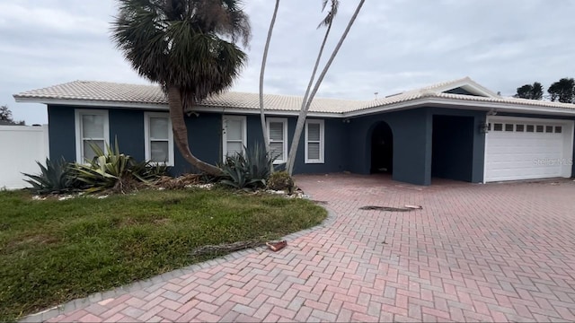 single story home with a garage