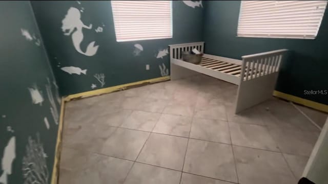 bedroom featuring a nursery area