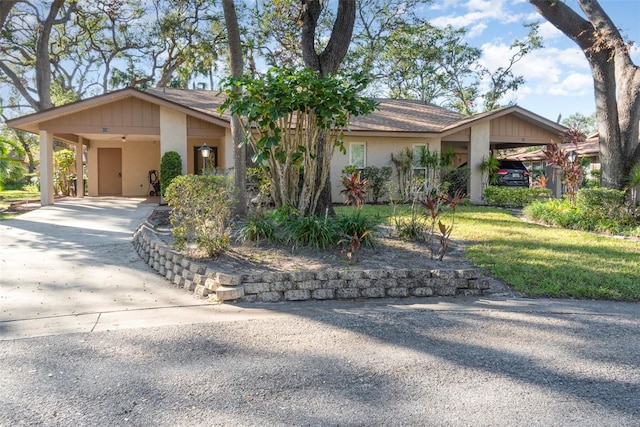 ranch-style house featuring a carport