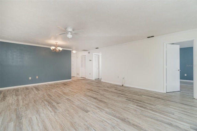 spare room with ceiling fan with notable chandelier, light hardwood / wood-style flooring, and crown molding