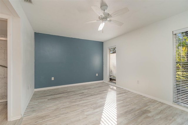 empty room featuring light hardwood / wood-style floors and ceiling fan