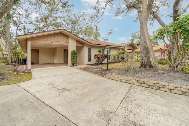 ranch-style house featuring a carport