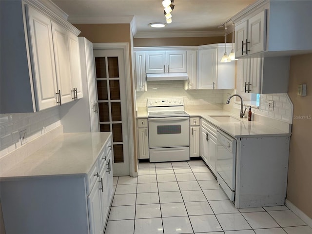 kitchen featuring white dishwasher, range with electric stovetop, white cabinets, and backsplash