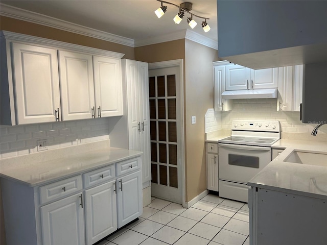 kitchen with white electric range oven, decorative backsplash, white cabinetry, and sink