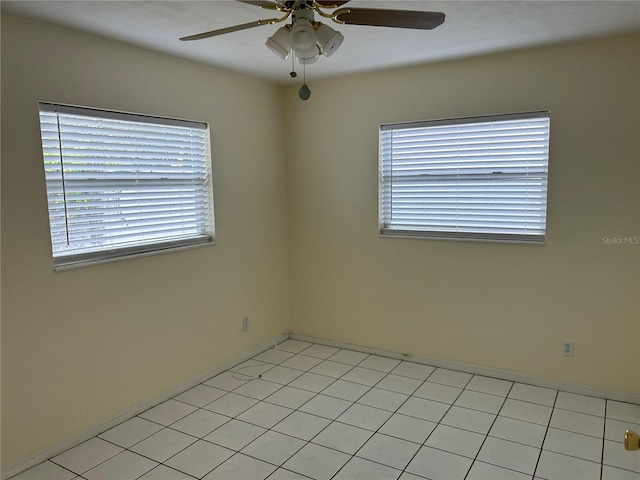10170 64th Ave, Seminole, FL 33772 - unfurnished room featuring a ceiling fan, healthy amount of natural light, and baseboards