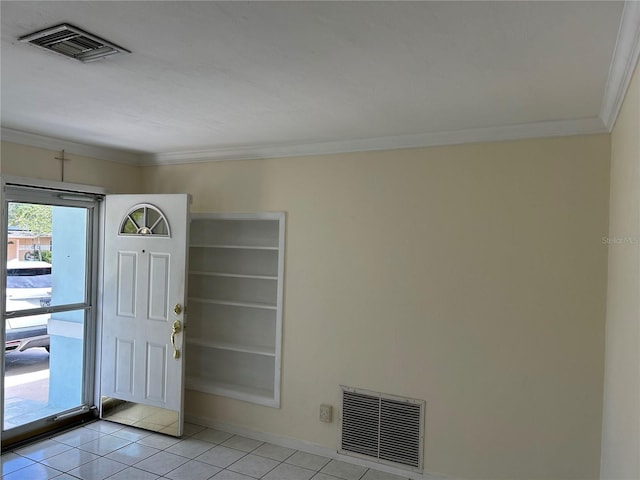 10170 64th Ave, Seminole, FL 33772 - entrance foyer with light tile patterned flooring, ornamental molding, and baseboards