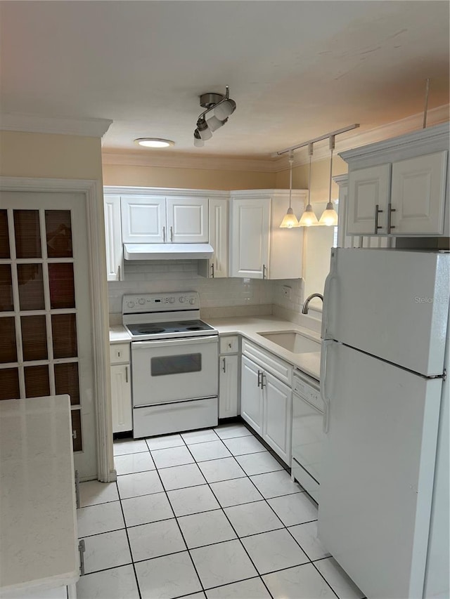 10170 64th Ave, Seminole, FL 33772 - kitchen featuring white appliances, a sink, light countertops, white cabinets, and crown molding