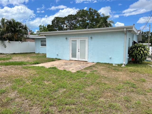 10170 64th Ave, Seminole, FL 33772 - back of property featuring stucco siding, a patio area, and french doors