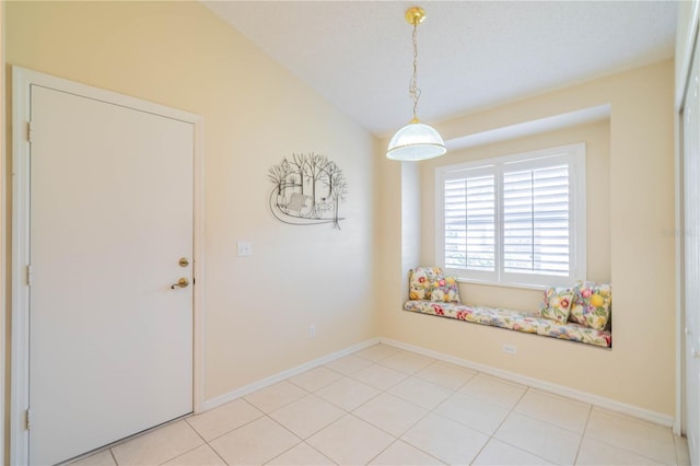 tiled spare room featuring a textured ceiling