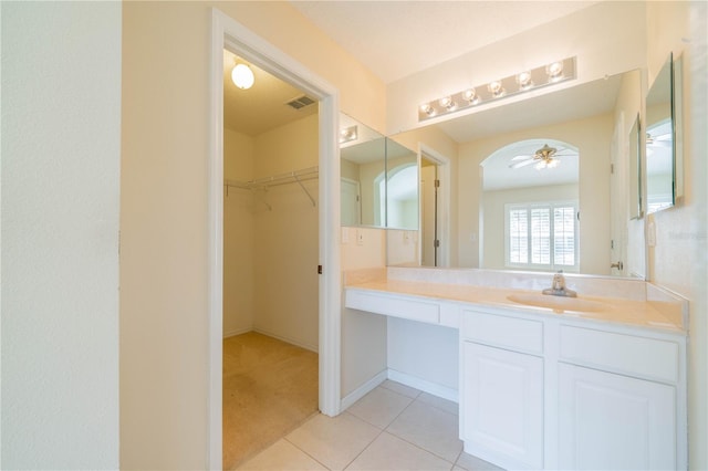 bathroom with tile patterned floors, ceiling fan, and vanity