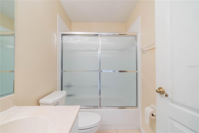 1257 Corinth Greens Dr Unit 1257, Sun City Center, FL 33573 - full bath with vanity, toilet, shower / bath combination with glass door, and tile patterned floors
