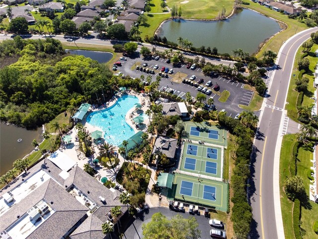 1257 Corinth Greens Dr Unit 1257, Sun City Center, FL 33573 - drone / aerial view of a pool, a nearby body of water, and a golf course
