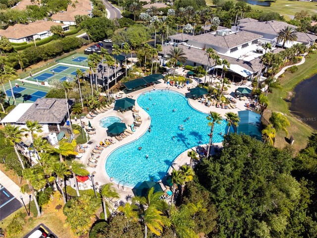 1257 Corinth Greens Dr Unit 1257, Sun City Center, FL 33573 - drone / aerial view of a pool area and a local golf course